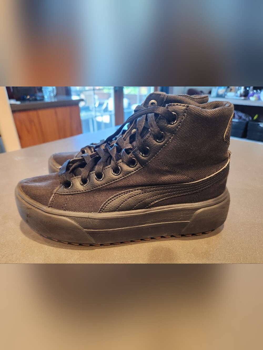Puma Black High-Top Platform Sneakers.